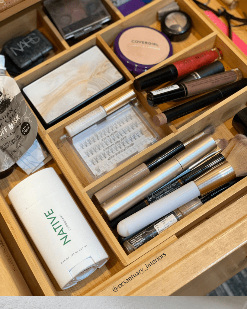 drawer divider with make up inside each slot